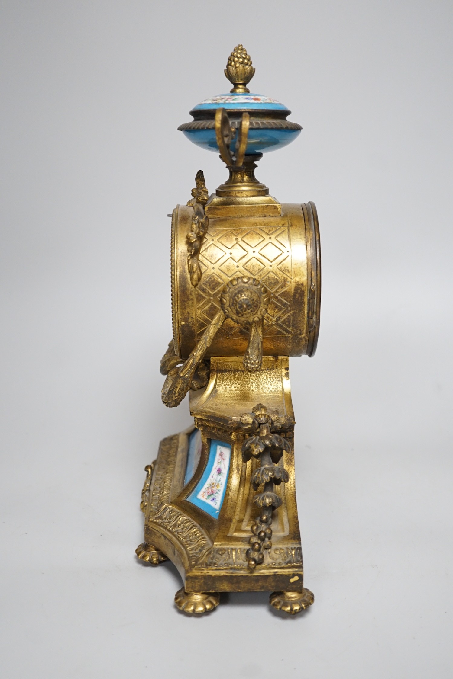 A 19th century French gilt-brass mantel clock with Sevres-style panels, 33cm